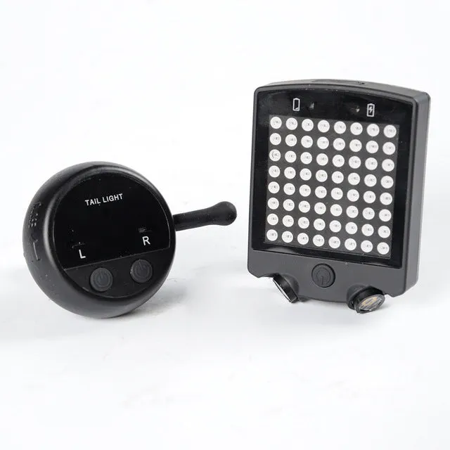 Black LED bicycle turn signal unit with dot matrix display and laser line, wireless remote control, on a bicycle seatpost