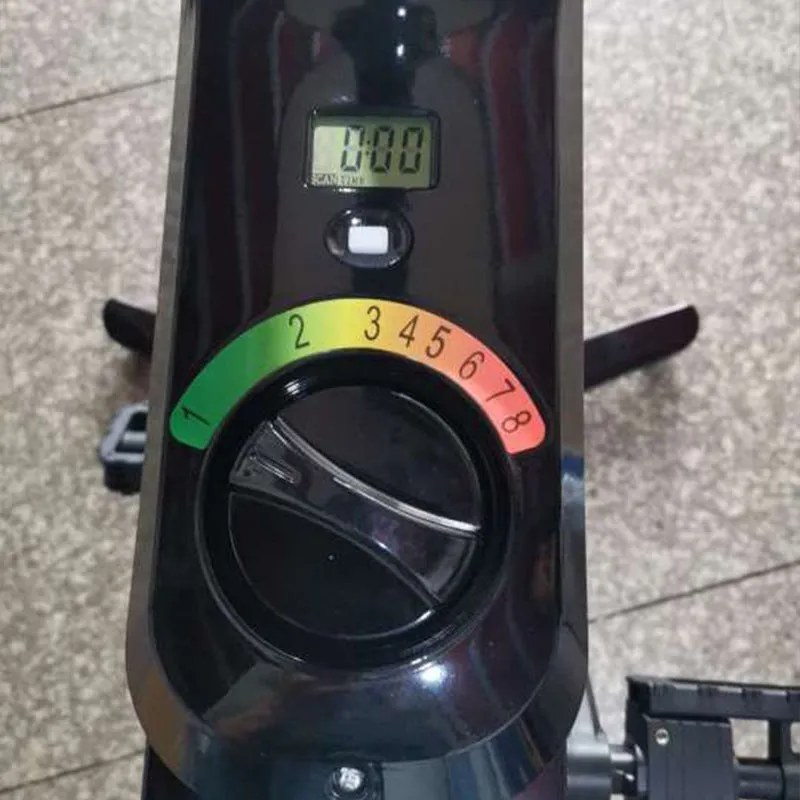 Black upright exercise bike with magnetic resistance and built-in table for home fitness