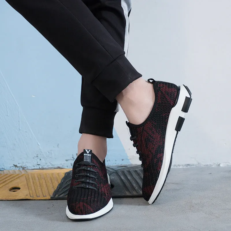 Men's black cloth upper sports casual shoes with rubber sole, low heel, and lace-up closure on a neutral background
