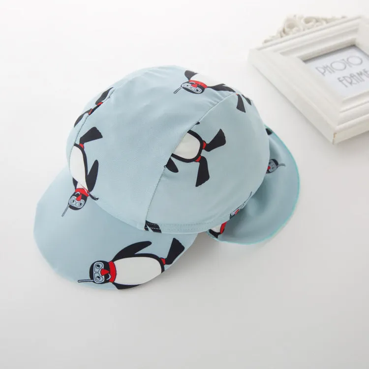 Boy's long sleeve penguin print swimsuit two-piece set with matching swimming cap