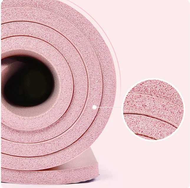 Widened blue TPE yoga mat 183x61cm on floor for home fitness stretching