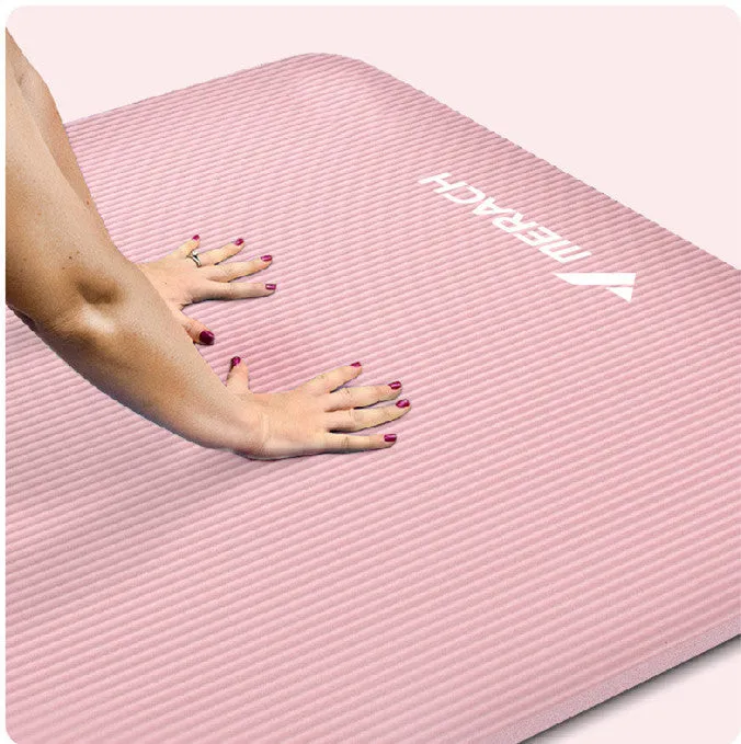 Widened blue TPE yoga mat 183x61cm on floor for home fitness stretching
