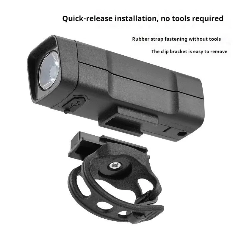 Black bicycle headlight with quick release strap bracket mounted on handlebars
