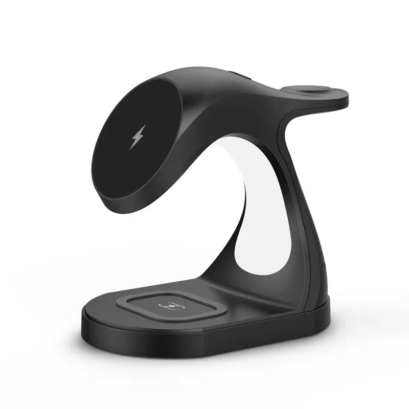 Fast Four In One Magnetic Wireless Fast Charger in black with phone, earphones, and watch placed on charging areas