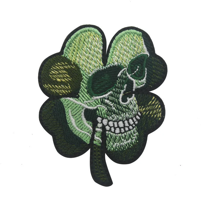 Embroidered fabric badge with Velcro strip showing clover design in green colour
