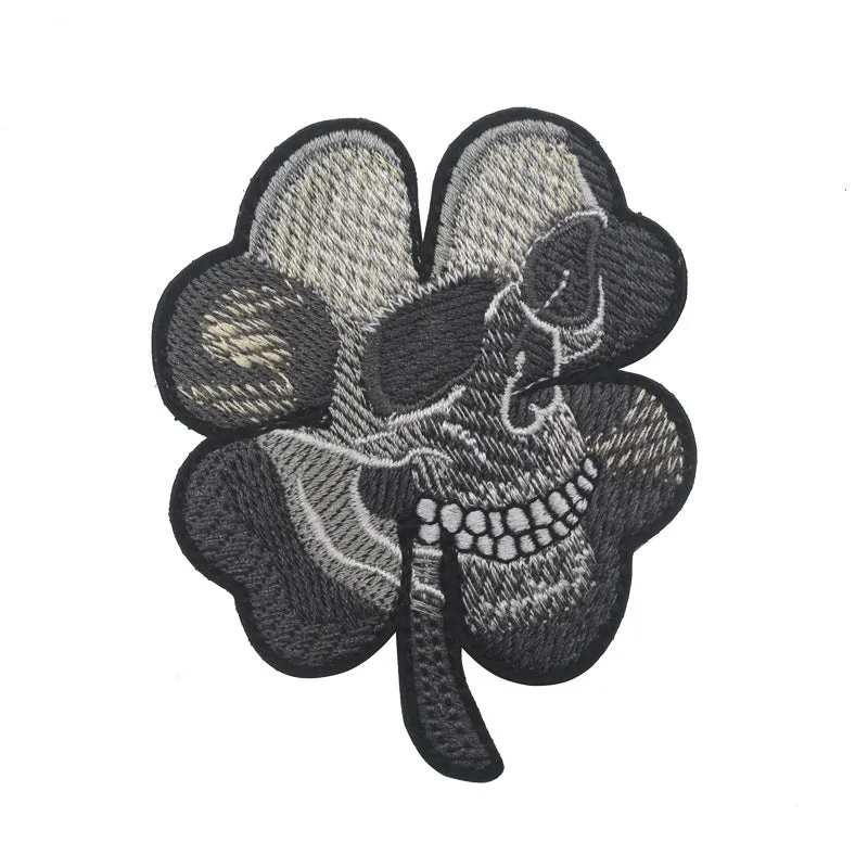 Embroidered fabric badge with Velcro strip showing clover design in green colour