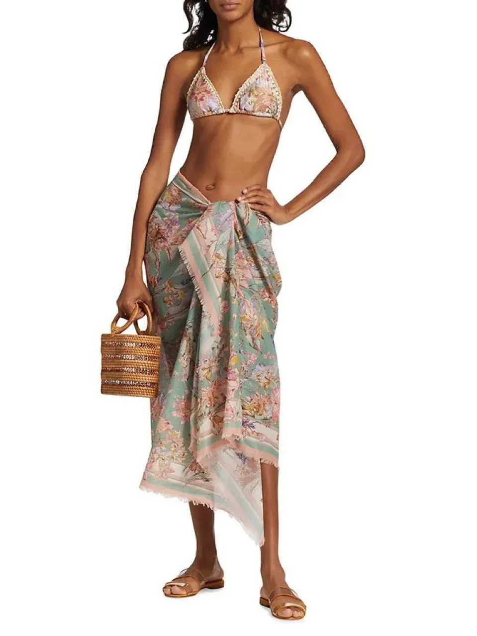 Women's creamy-white floral bikini set with matching skirt bottom