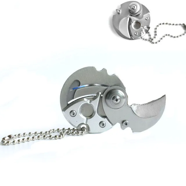 Stainless steel camping survival knife with black aluminium alloy handle on white background