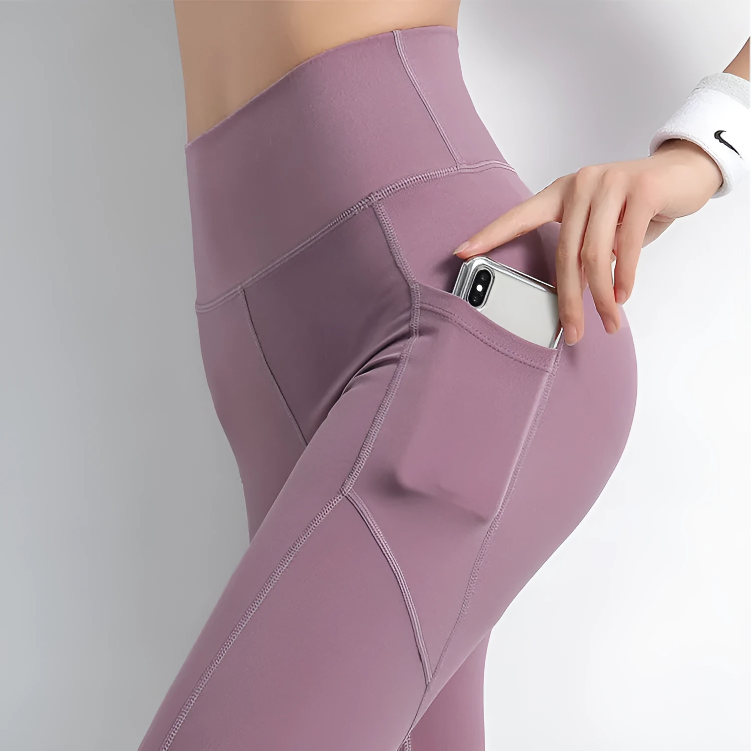 Sports leggings with pockets for women in chemical fibre blend polyester and spandex, available in navy black purple blue sizes S M L XL, suitable for body building across all seasons