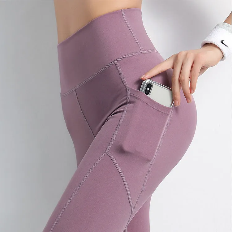 Sports leggings with pockets for women in chemical fibre blend polyester and spandex, available in navy black purple blue sizes S M L XL, suitable for body building across all seasons