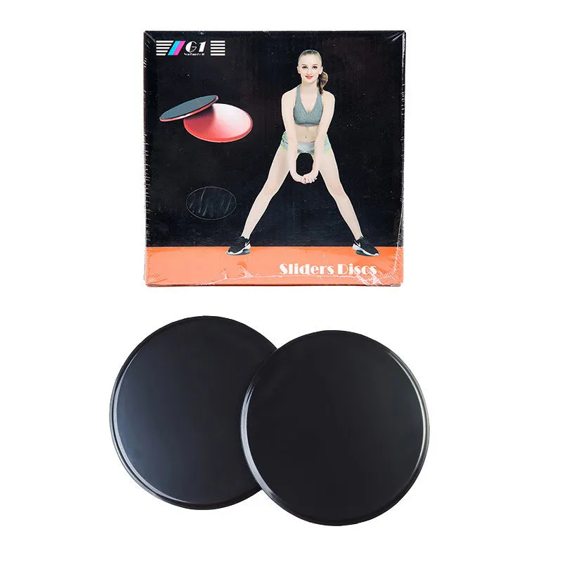 Two pink fitness sliding discs on hard floor showing double-sided texture, 18x18x2cm