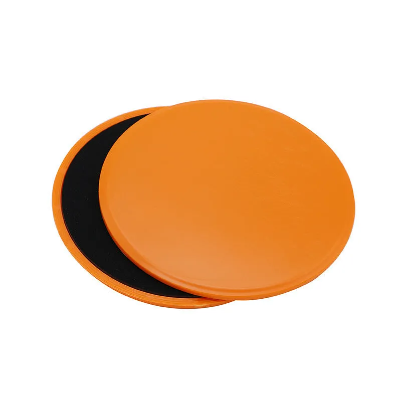 Two pink fitness sliding discs on hard floor showing double-sided texture, 18x18x2cm