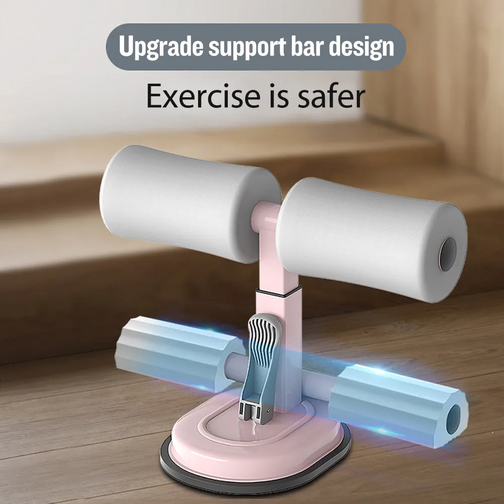 Pink adjustable sit-up bar floor assistant with foam pad and suction base on smooth floor