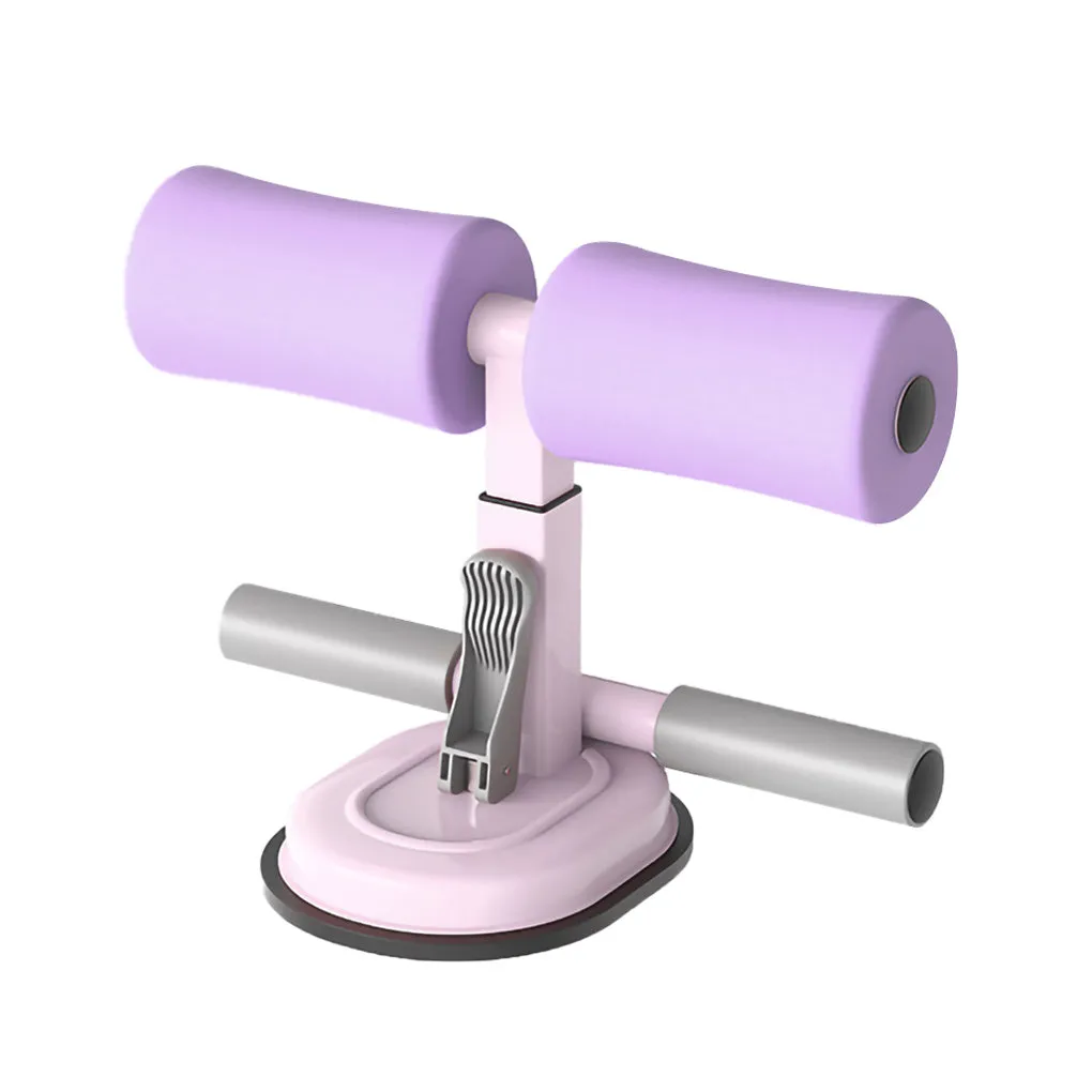 Pink adjustable sit-up bar floor assistant with foam pad and suction base on smooth floor
