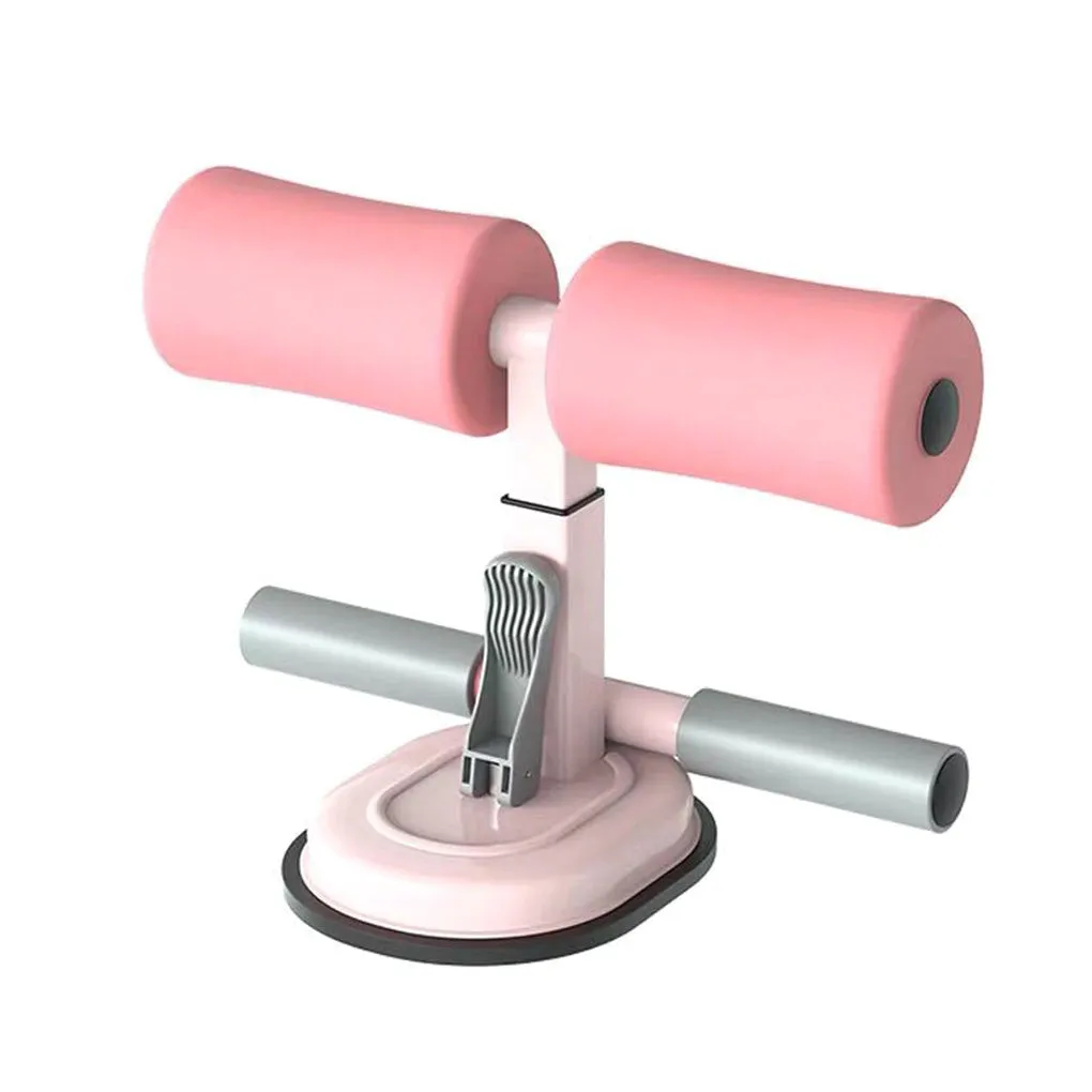 Pink adjustable sit-up bar floor assistant with foam pad and suction base on smooth floor