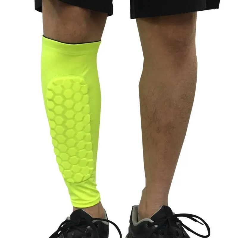 Black lycra football shin guard holder with silicone band on a leg showing secure fit