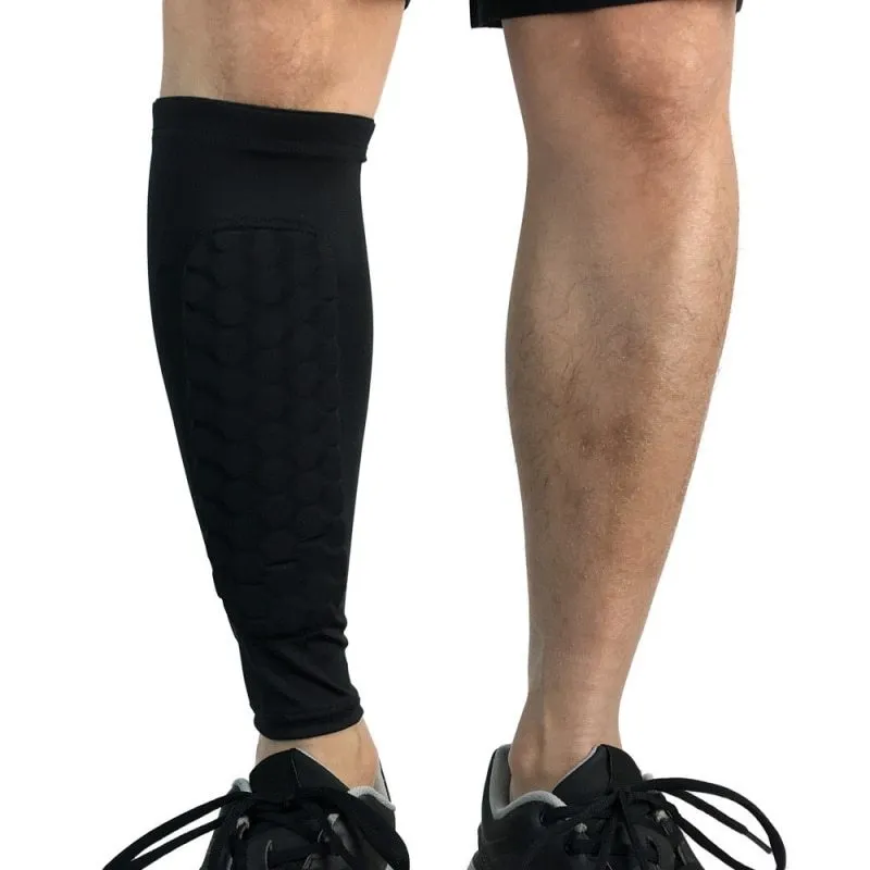 Black lycra football shin guard holder with silicone band on a leg showing secure fit