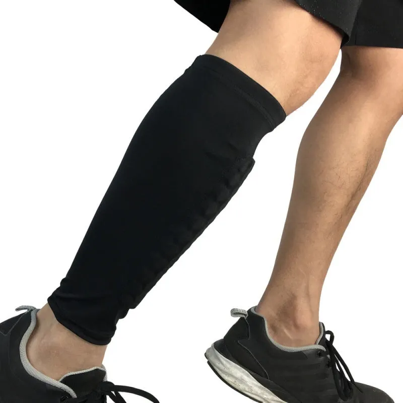 Black lycra football shin guard holder with silicone band on a leg showing secure fit