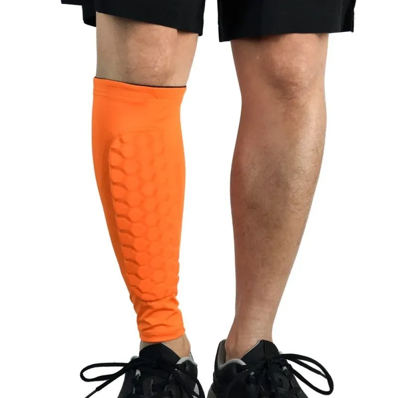 Black lycra football shin guard holder with silicone band on a leg showing secure fit