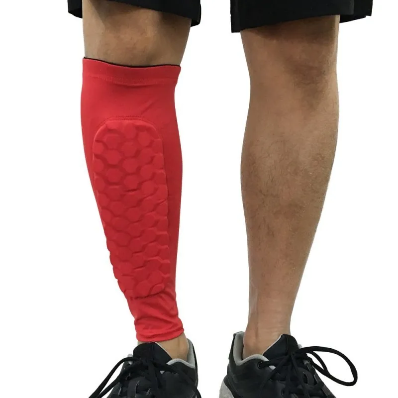 Black lycra football shin guard holder with silicone band on a leg showing secure fit