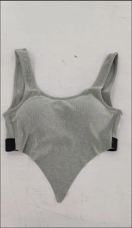 Solid colour polyester fibre sports bra in Black, Grey, Pink, or White for gym and yoga support