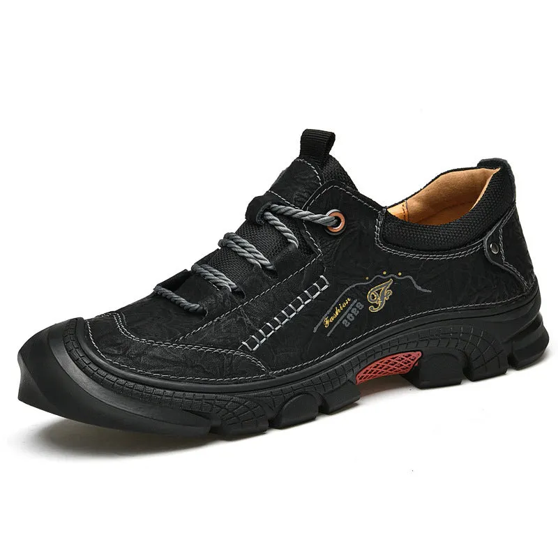 Non-slip wear-resistant hiking boots in black with leather upper and rubber sole for outdoor cross-country use