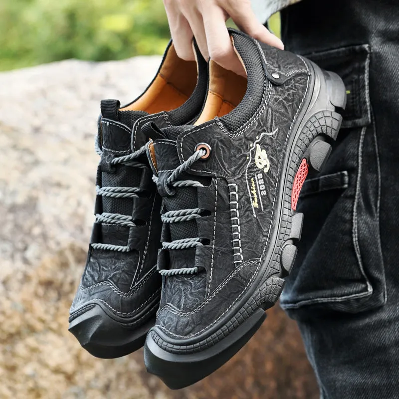 Non-slip wear-resistant hiking boots in black with leather upper and rubber sole for outdoor cross-country use