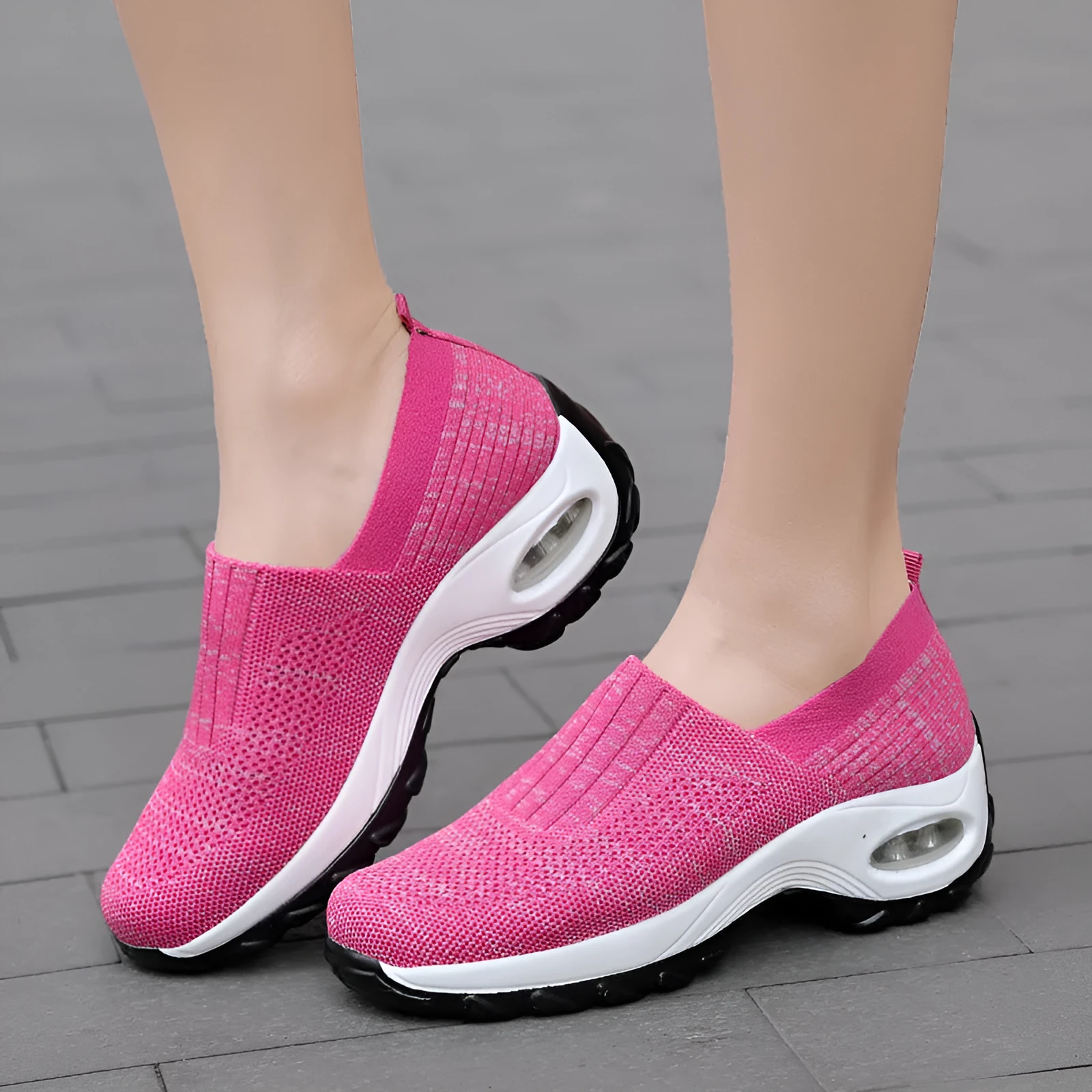 Women's mesh sports shoes in black, side view, showing breathable upper, thick bottom sole, and slip-on design
