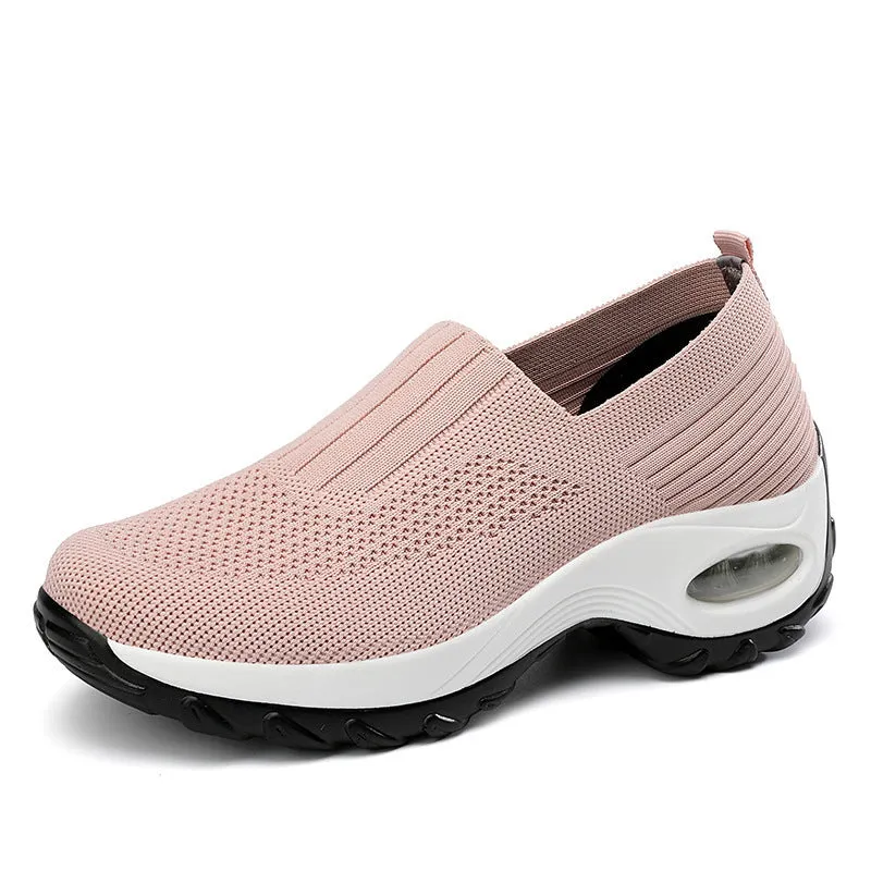 Women's mesh sports shoes in black, side view, showing breathable upper, thick bottom sole, and slip-on design