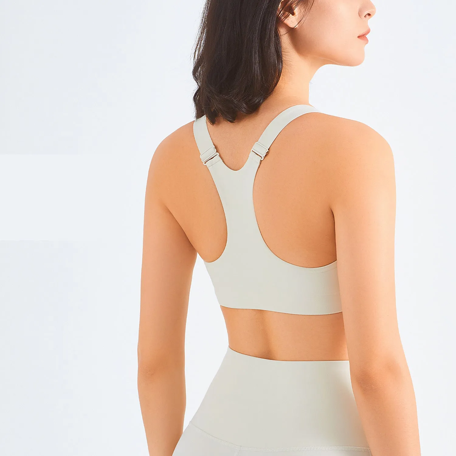 Zip front sports bra in Rhino Grey with racerback and mesh back panel for breathability