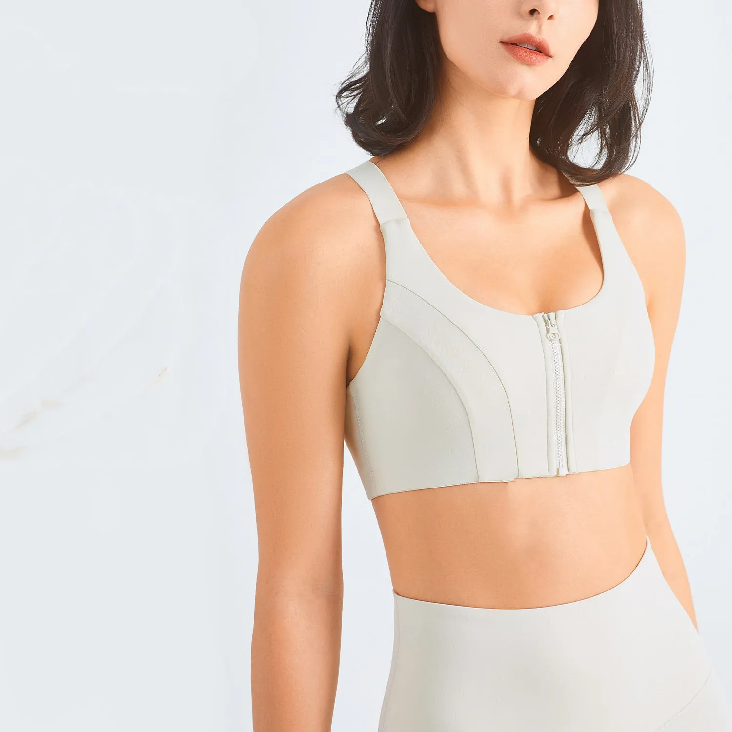 Zip front sports bra in Rhino Grey with racerback and mesh back panel for breathability
