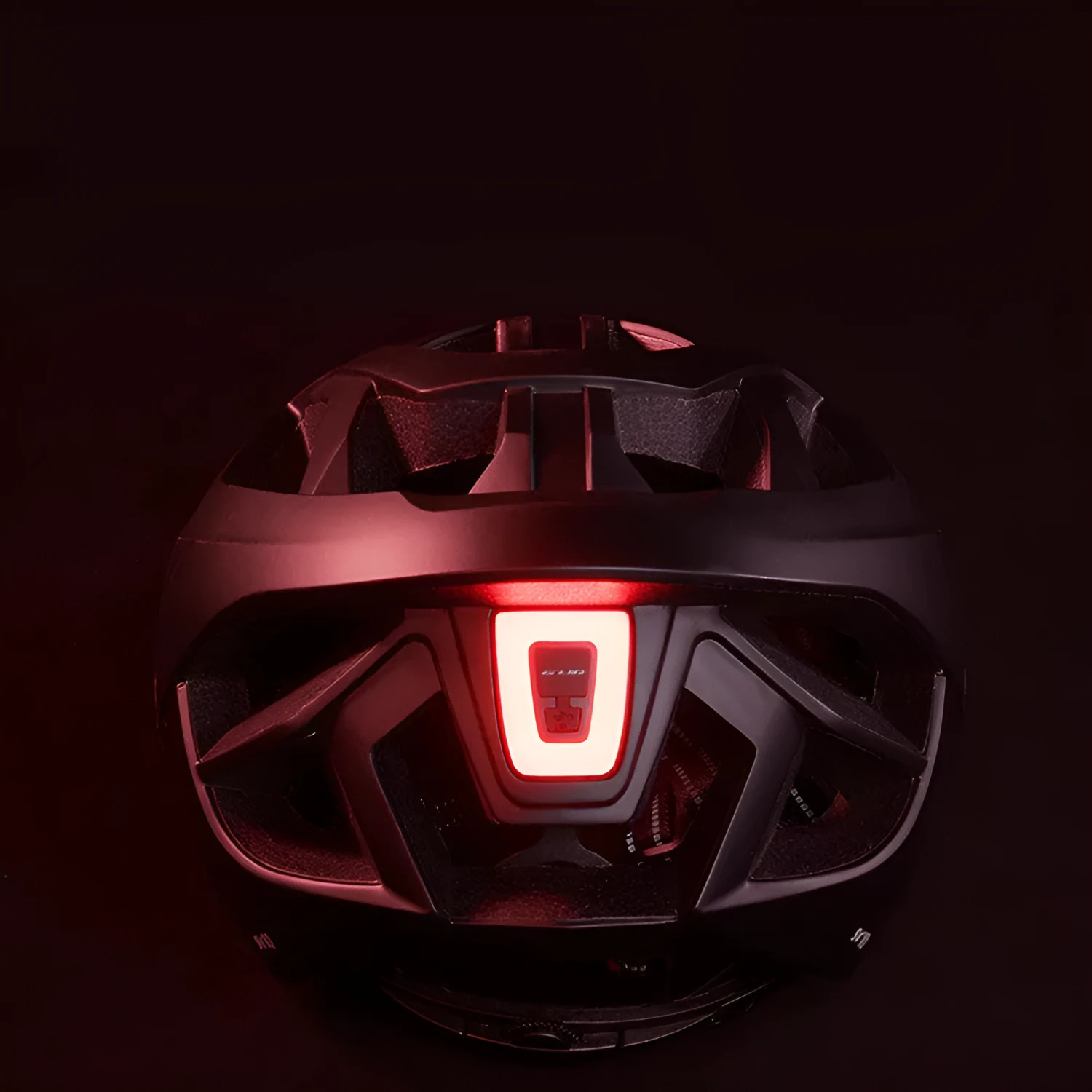 Mountain road bike helmet with built-in LED taillight, 17 vents, matt black finish, side view