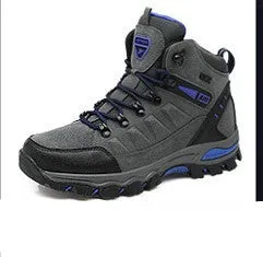 Black high-top hiking shoes with front-tie laces and rubber sole on a neutral background