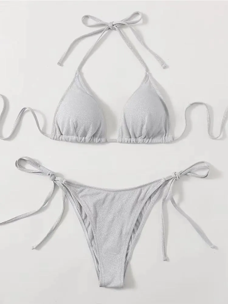 Women's split bandage style bikini swimsuit in polyester fabric on a mannequin.