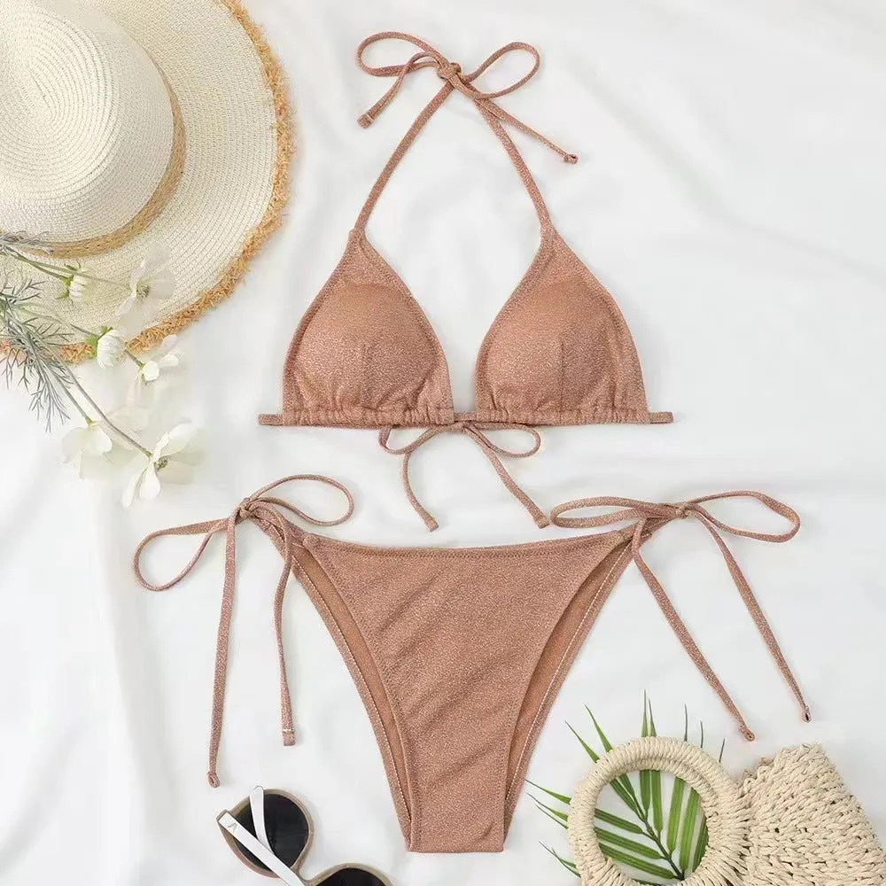 Women's split bandage style bikini swimsuit in polyester fabric on a mannequin.