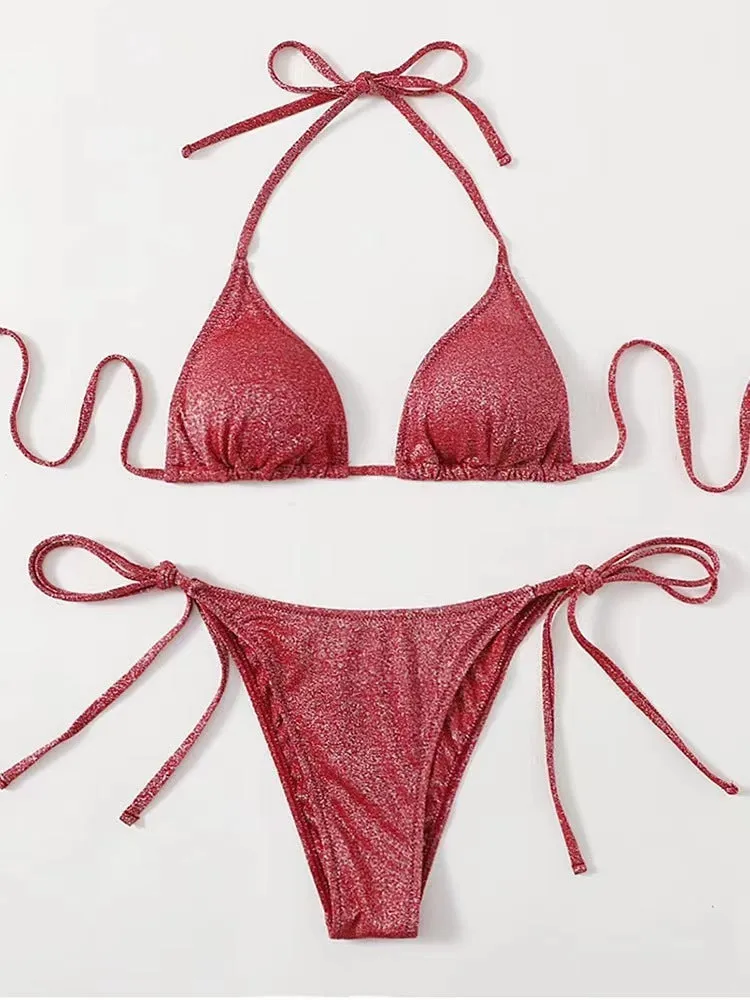 Women's split bandage style bikini swimsuit in polyester fabric on a mannequin.
