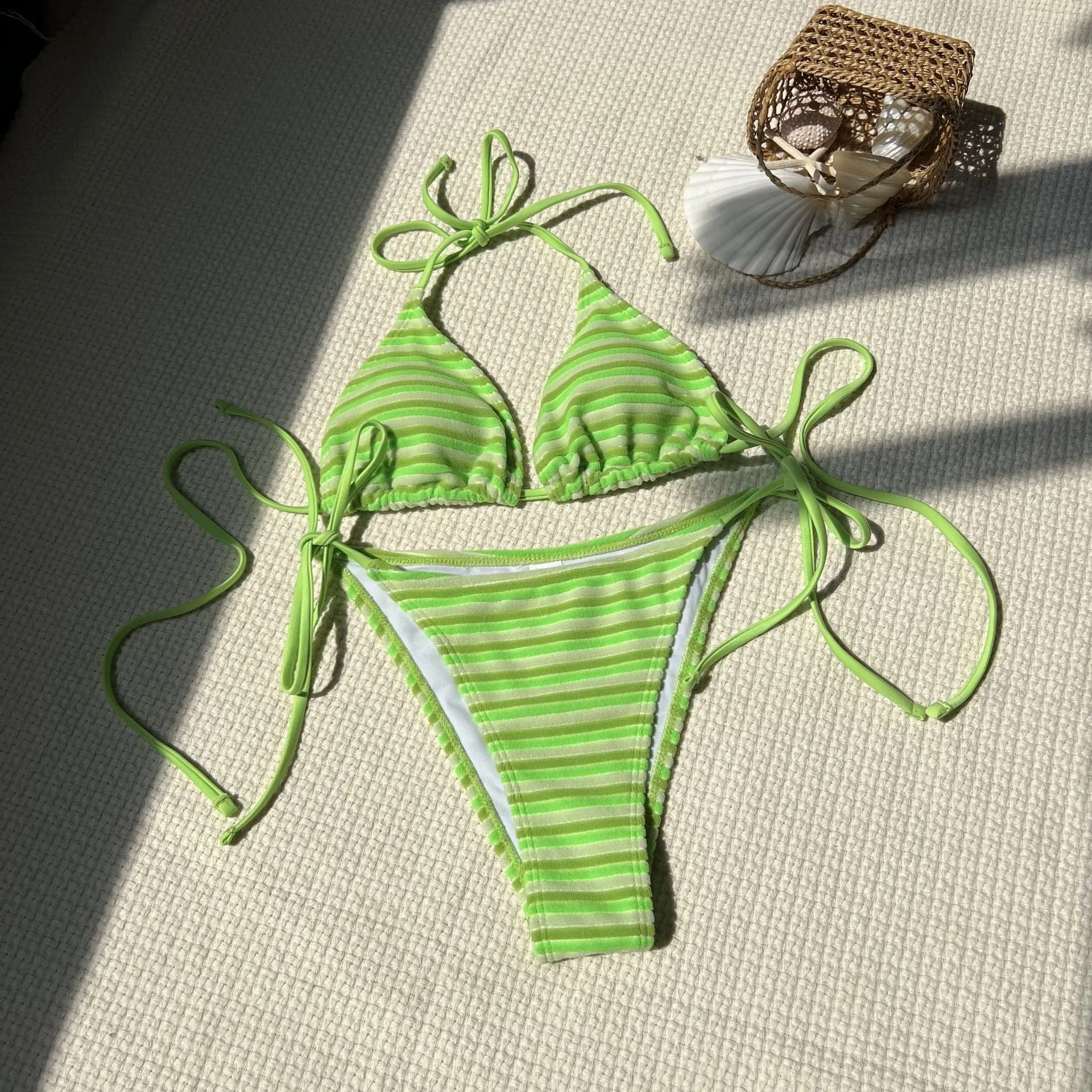Women's striped split bikini set in polyester briefs style for swimming and wading, available in multiple colours
