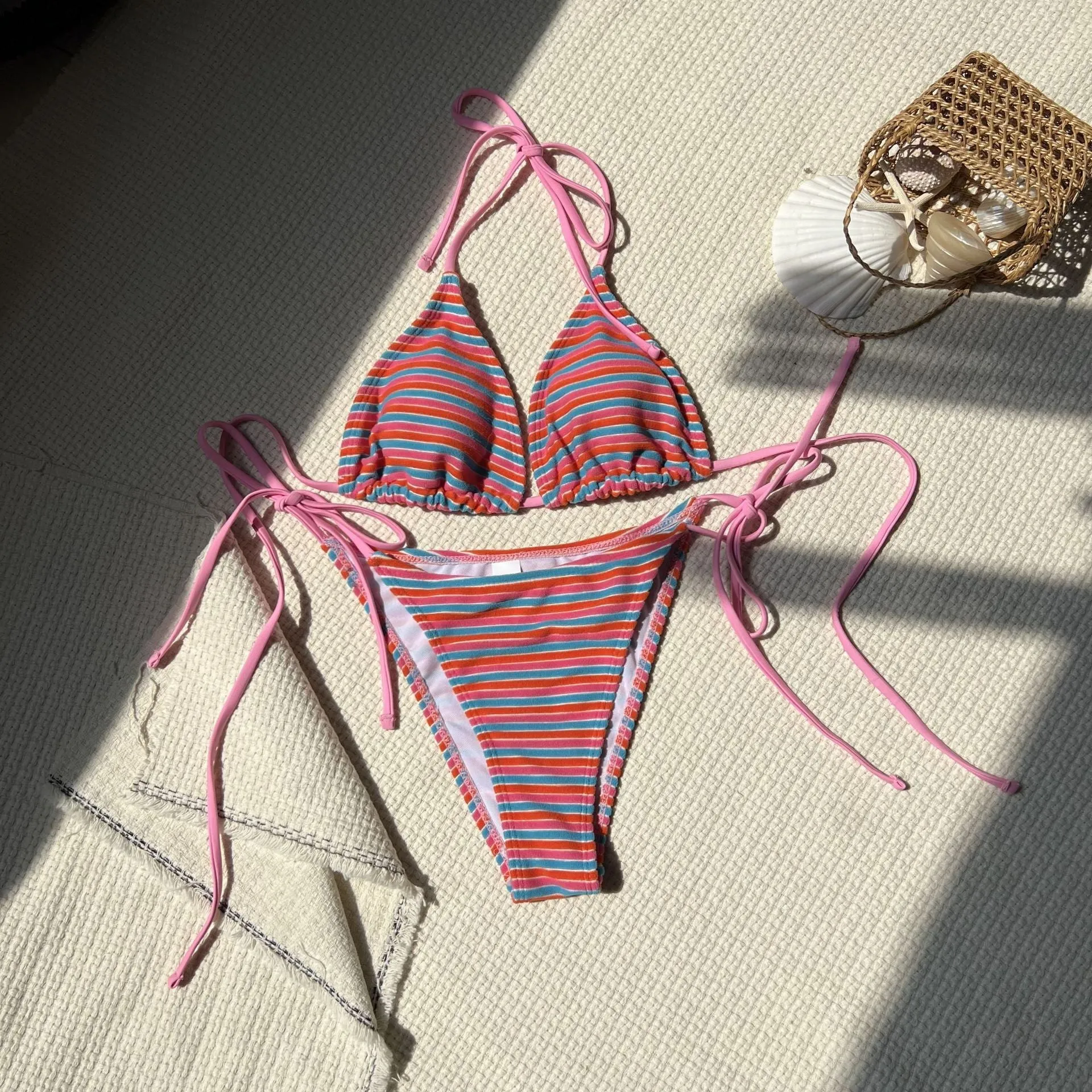 Women's striped split bikini set in polyester briefs style for swimming and wading, available in multiple colours