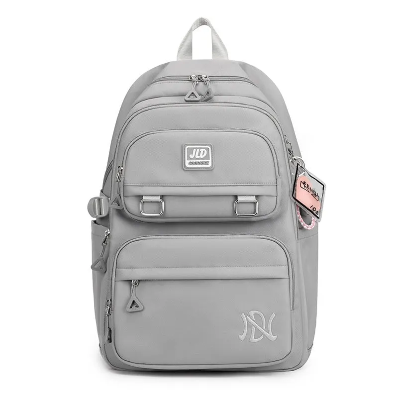 Girls' large capacity nylon school backpack in a selection of colours and graphic patterns on a physiological curve backplane.