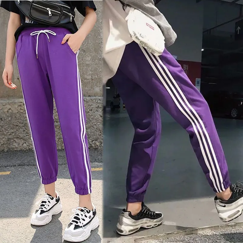 Quick-drying women's track pants in solid colour, loose-fit harem style with elastic waist