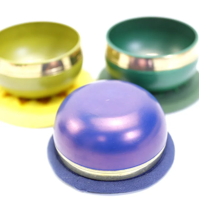 Handmade colourful Himalaya metal singing bowl and mallet, 7.8 cm in diameter.