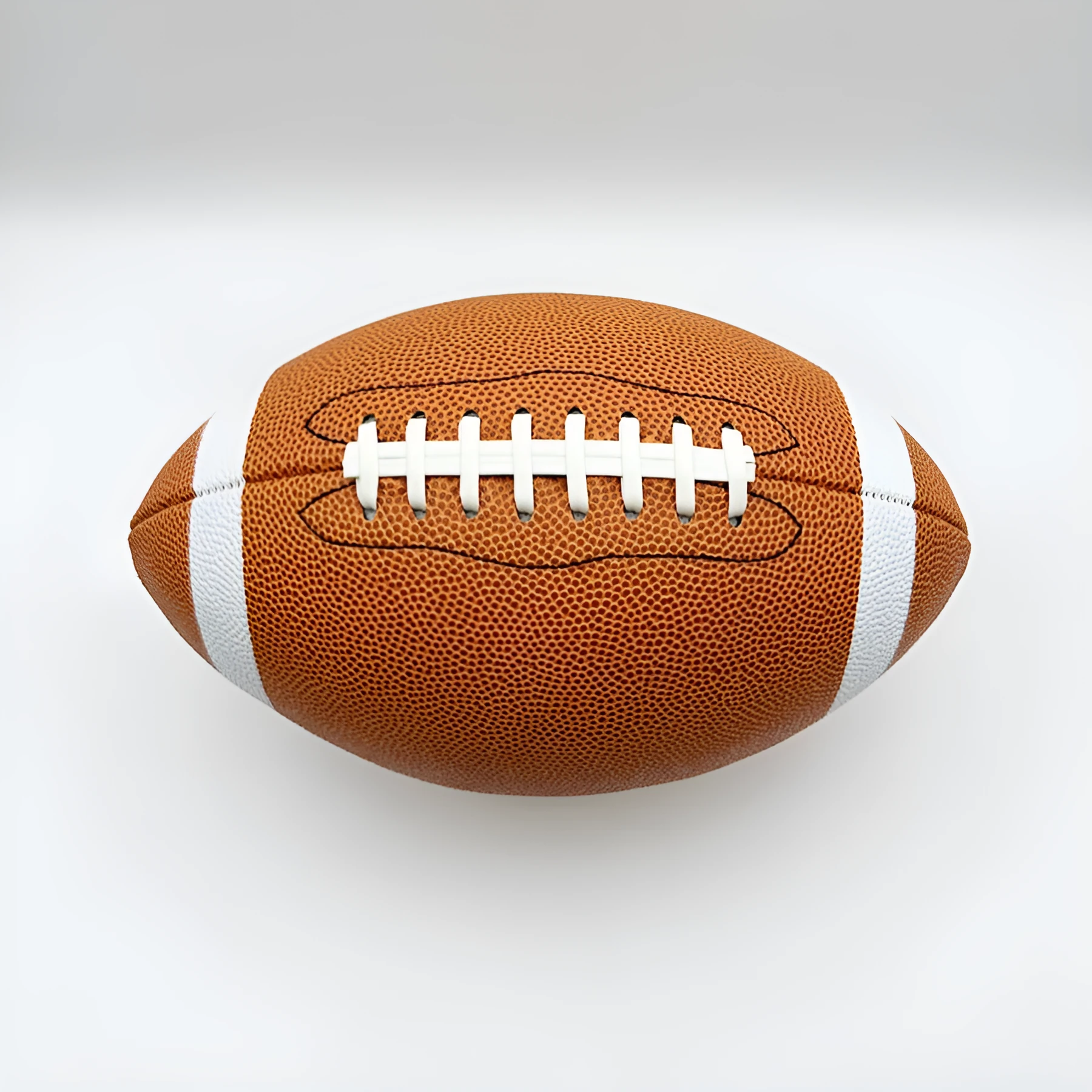 Machine sewn PU children's training American football in brown, shown with stitched seams and pointed ends for practice play