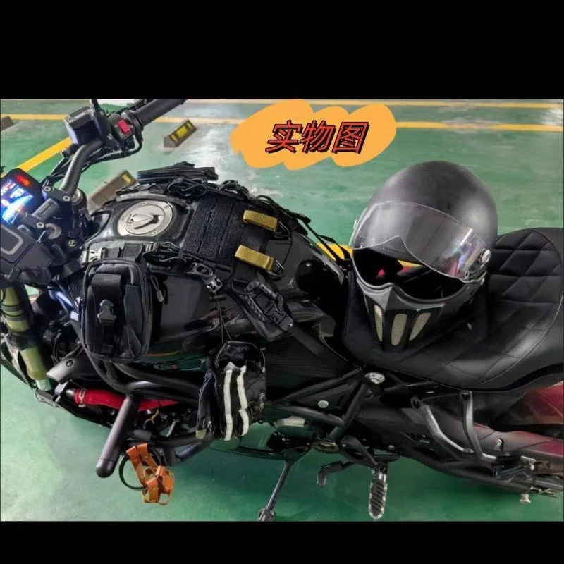 Universal black nylon motorcycle fuel tank bag mount base with adjustable straps on a black tank
