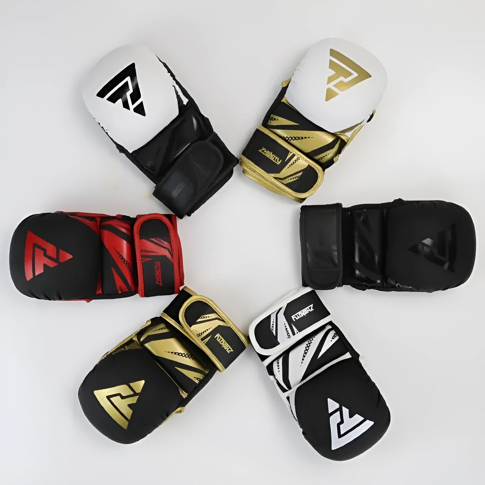 Black and red PU leather boxing gloves with thickened liner on a training mat