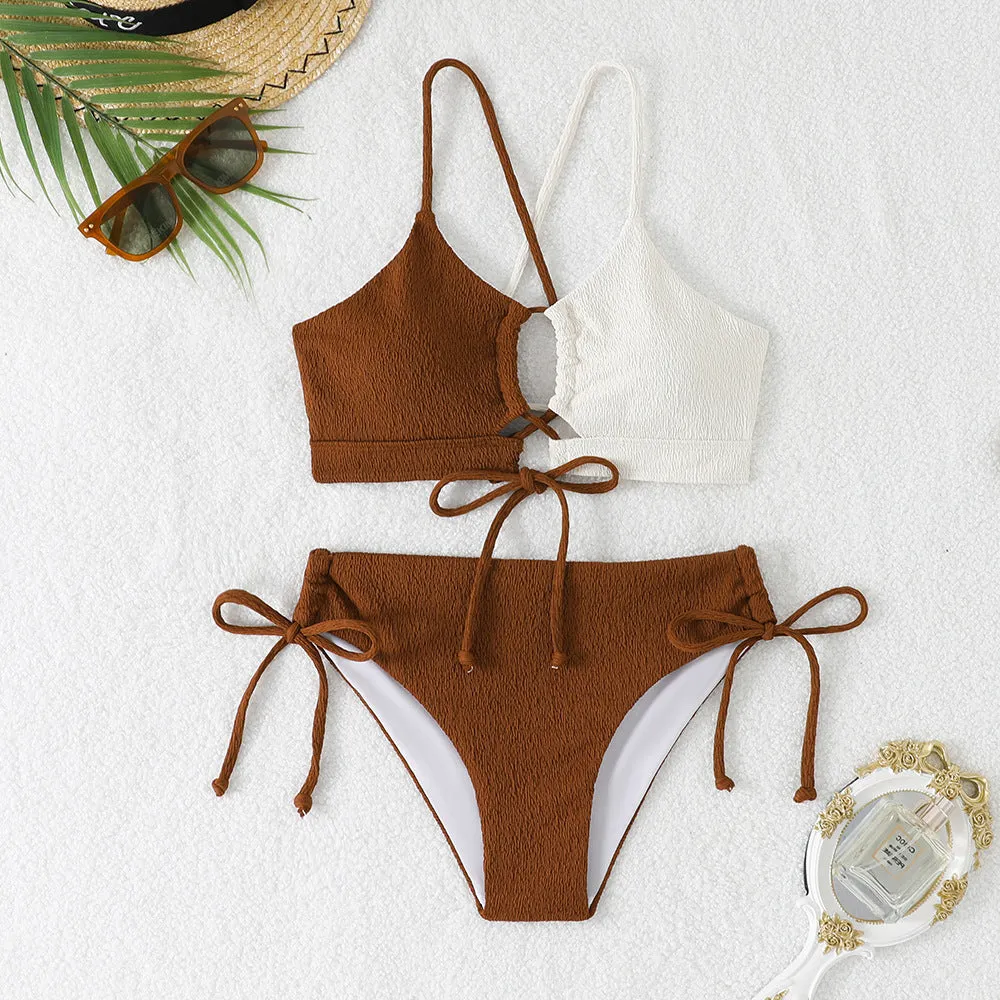 Women's black and white contrast colour cross sling hollow bikini set in polyester, front view