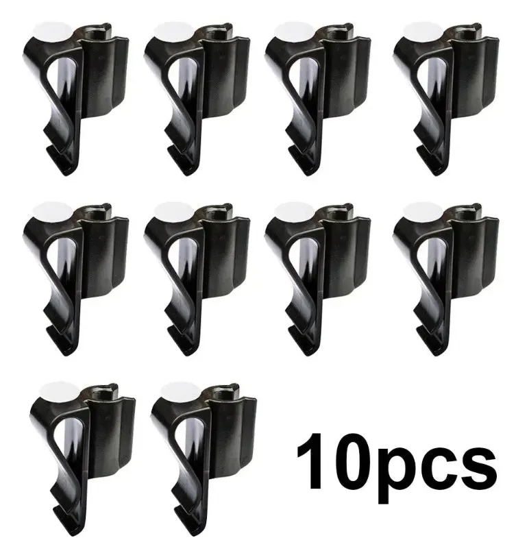 Black plastic putter fixing clip attached to golf bag, holding a putter securely