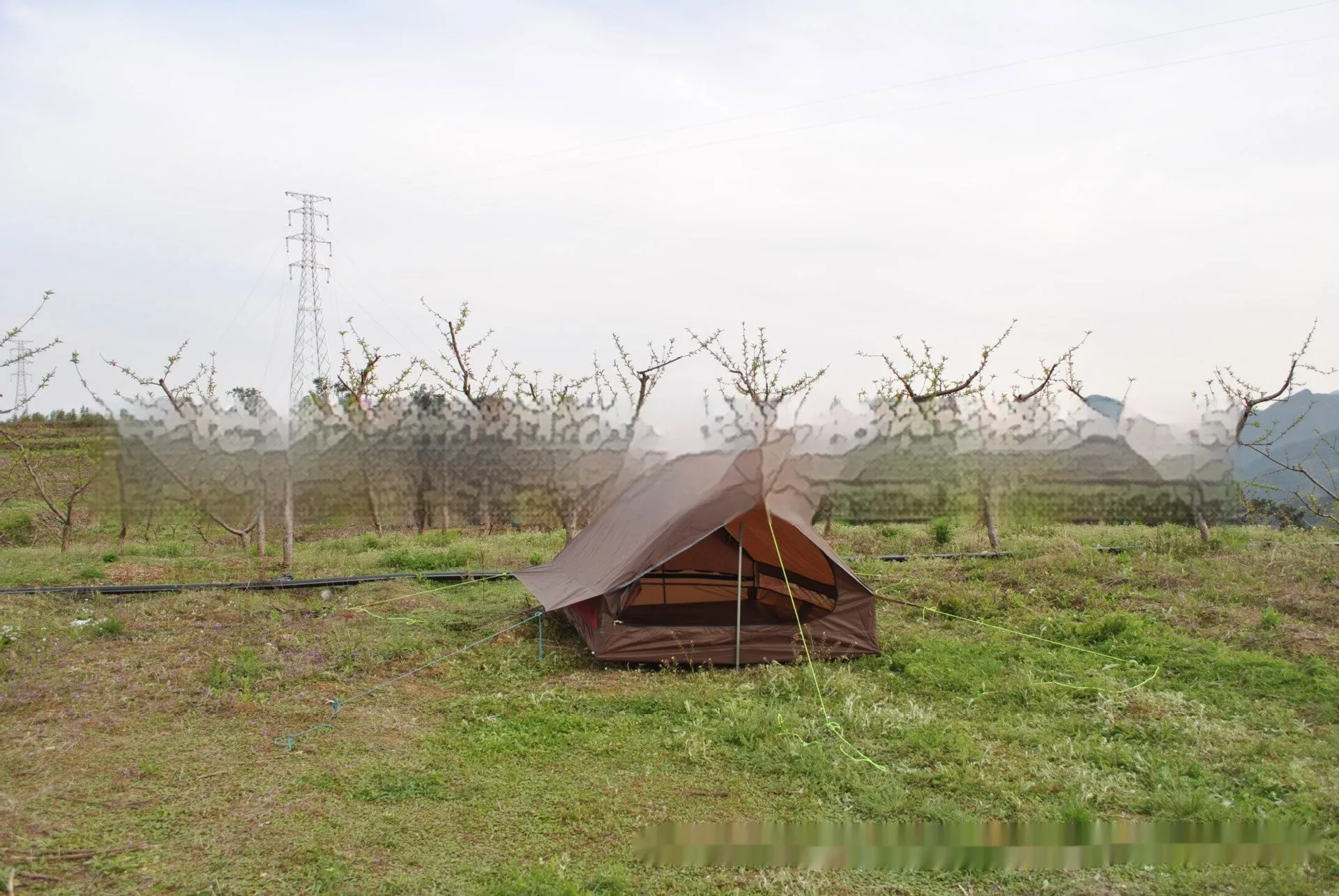 Brown or white A-line pole-free cabin tent for 2-3 people with hiking cane setup.