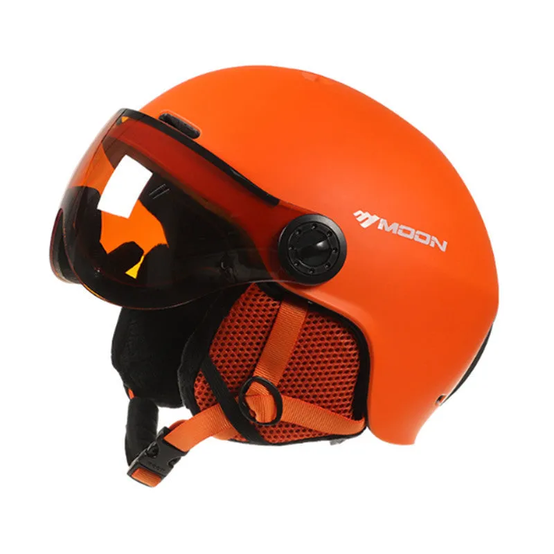 Moon ski helmet in black with polycarbonate shell and retractable visor on white background