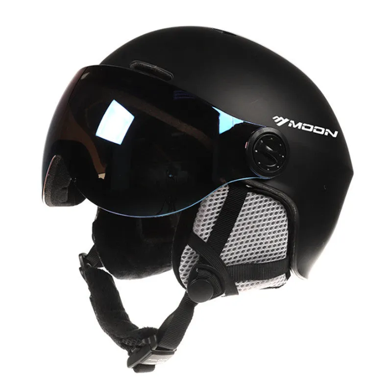 Moon ski helmet in black with polycarbonate shell and retractable visor on white background