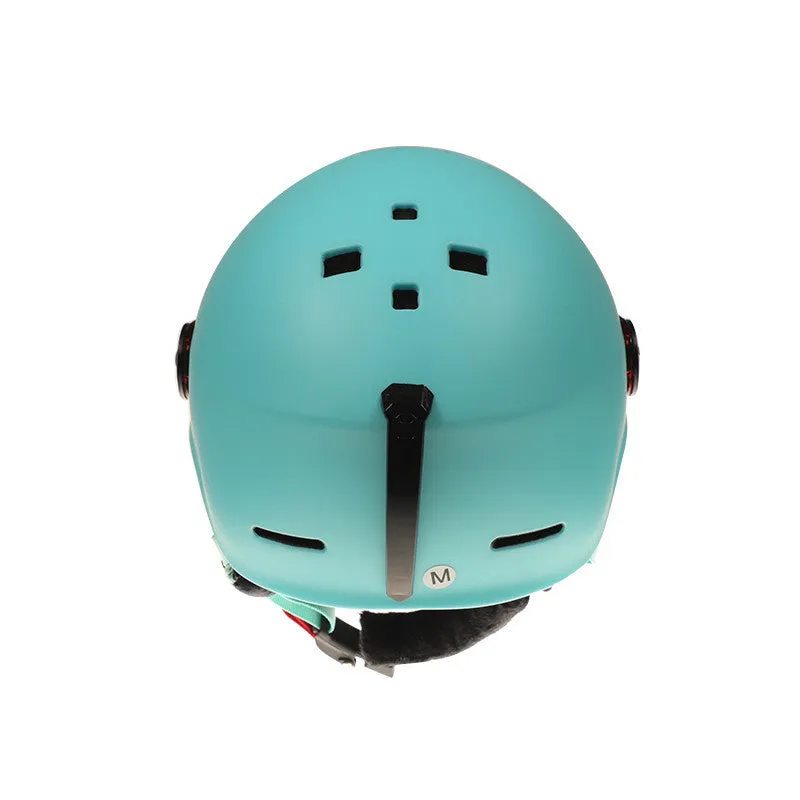 Moon ski helmet in black with polycarbonate shell and retractable visor on white background